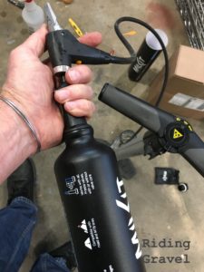 Charging a Milkit Booster bottle with a floor pump. 