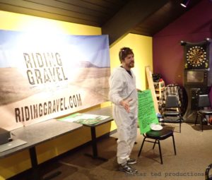 Man in hazmat suit at the Iowa Gravel Expo/Bike Party