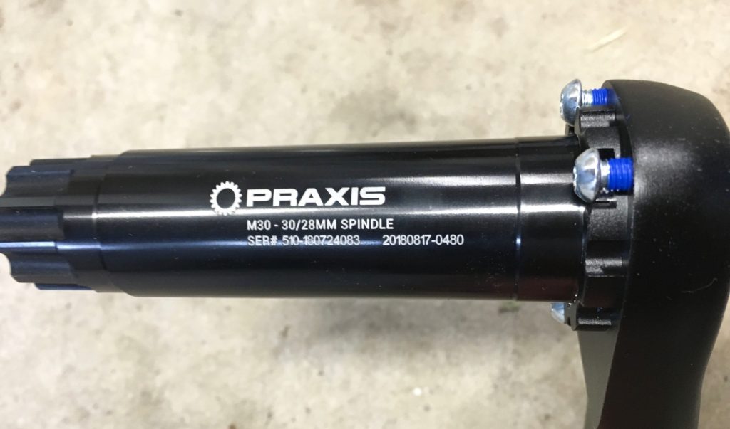 Praxis bottom bracket spindle and left arm assembly