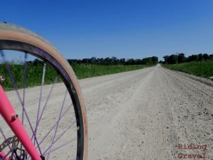A wheel and gravel road scene.
